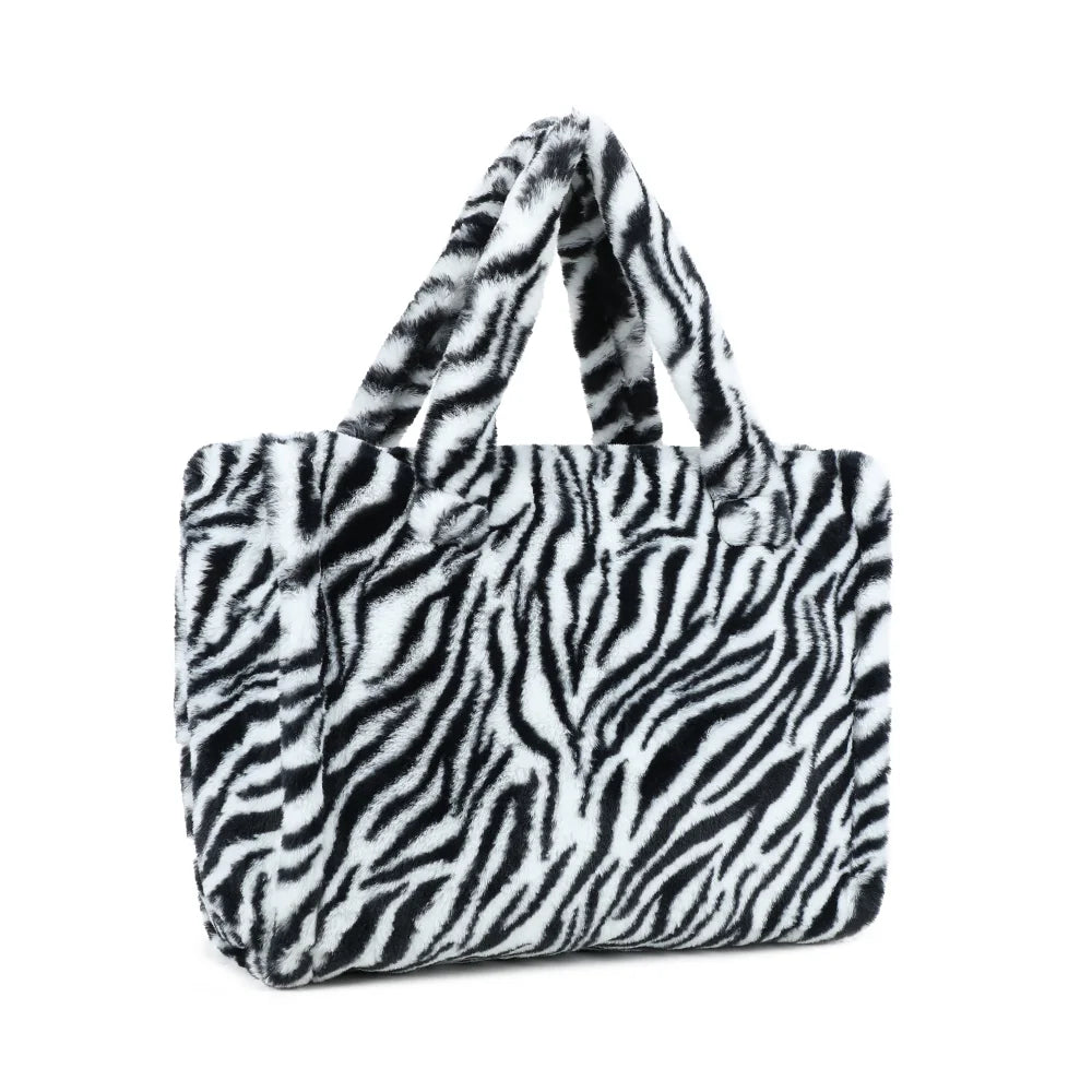 Mélya zebre de trois-quarts : volume du cabas en fausse fourrure et soufflets latéraux – réf. DG-5802