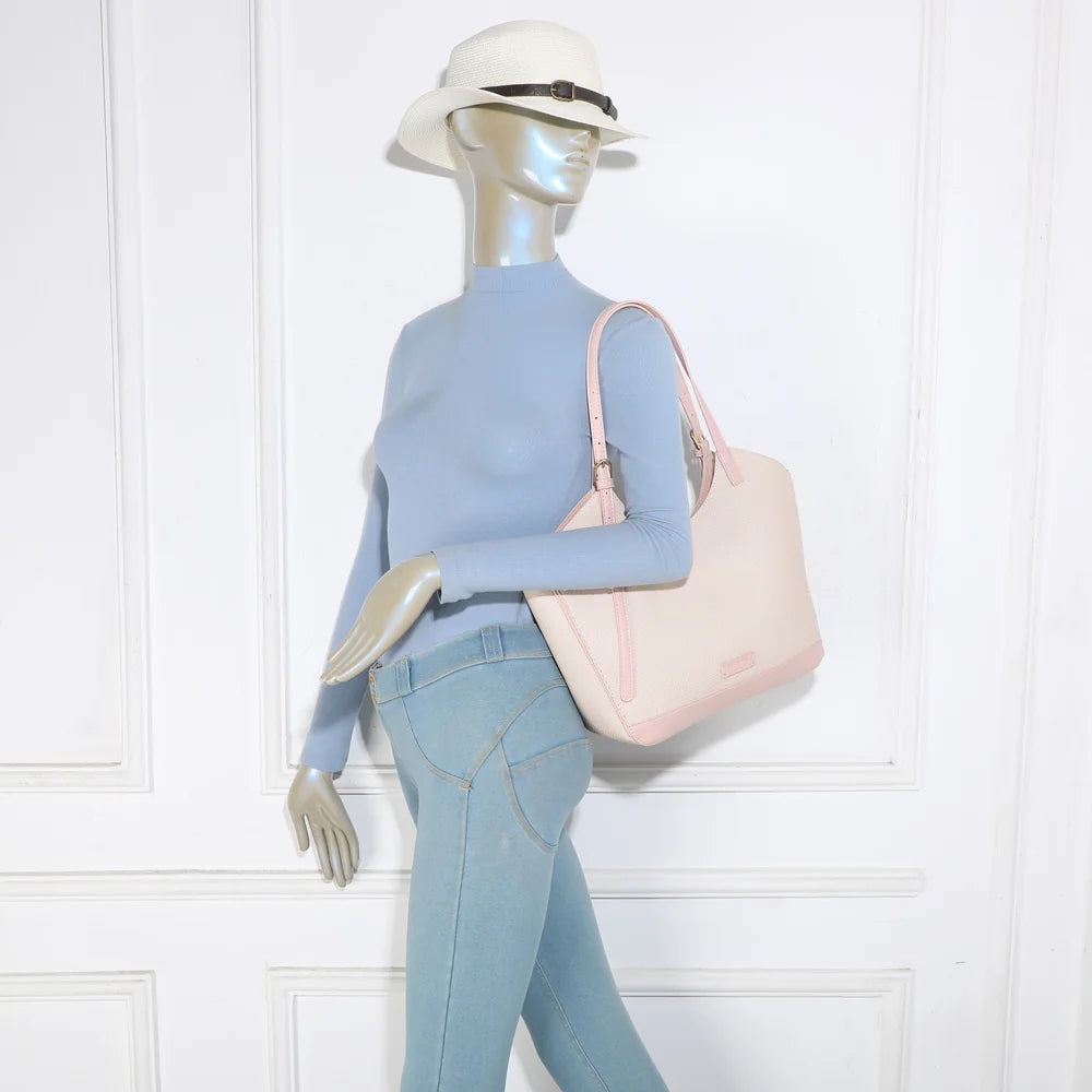Sac Modern Muse rose porté épaule par une femme grâce à ses anses longues réglables – réf. A-9148