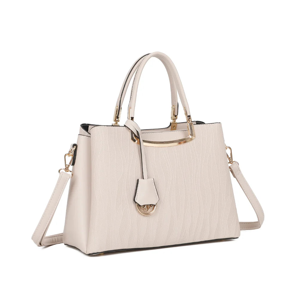 Noréline beige de trois quarts : silhouette structurée, breloque à fermoir doré et deux anses main – réf. DQ-8697