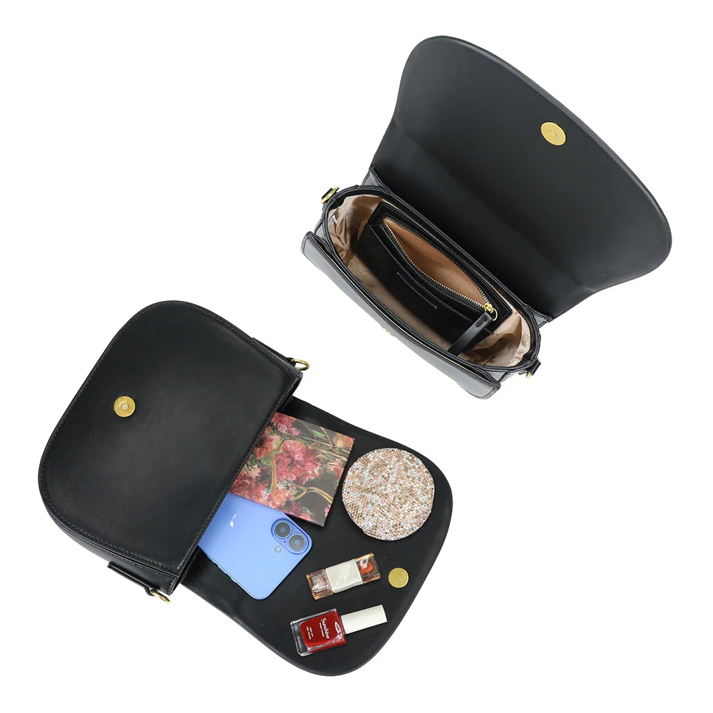 Intérieur du Nova Loop noir : bouton magnétique et poche zippée pour téléphone et petits essentiels