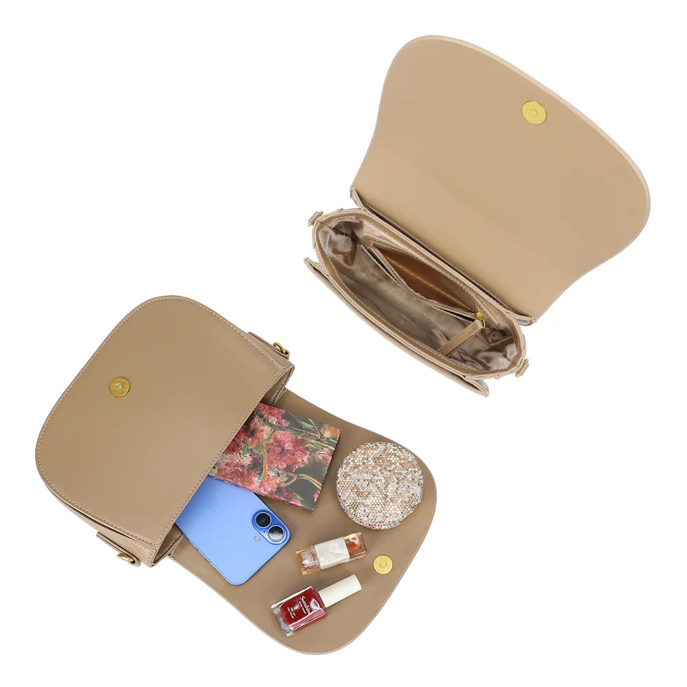 Intérieur du Nova Loop taupe : bouton magnétique et poche zippée pour téléphone et petits essentiels