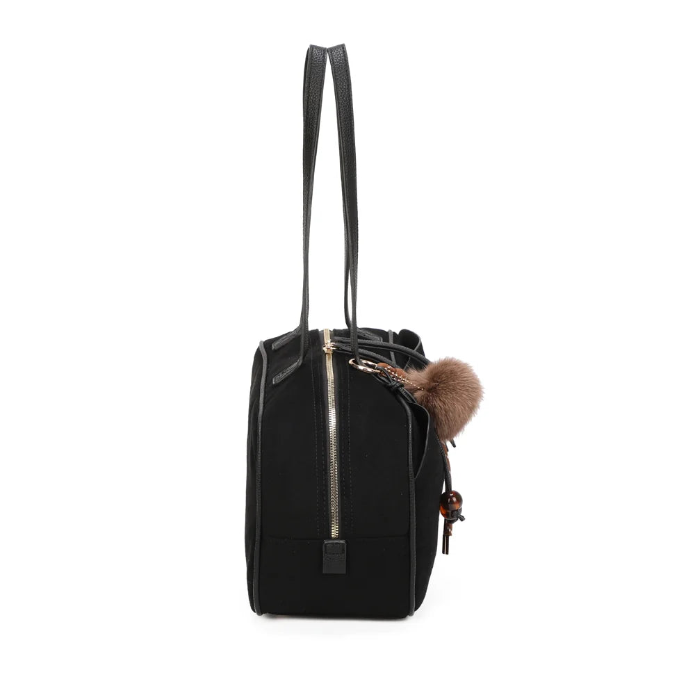 Profil du sac Ovalia noir : côté zippé et 14 cm de profondeur pour les essentiels du quotidien – réf. M-9451
