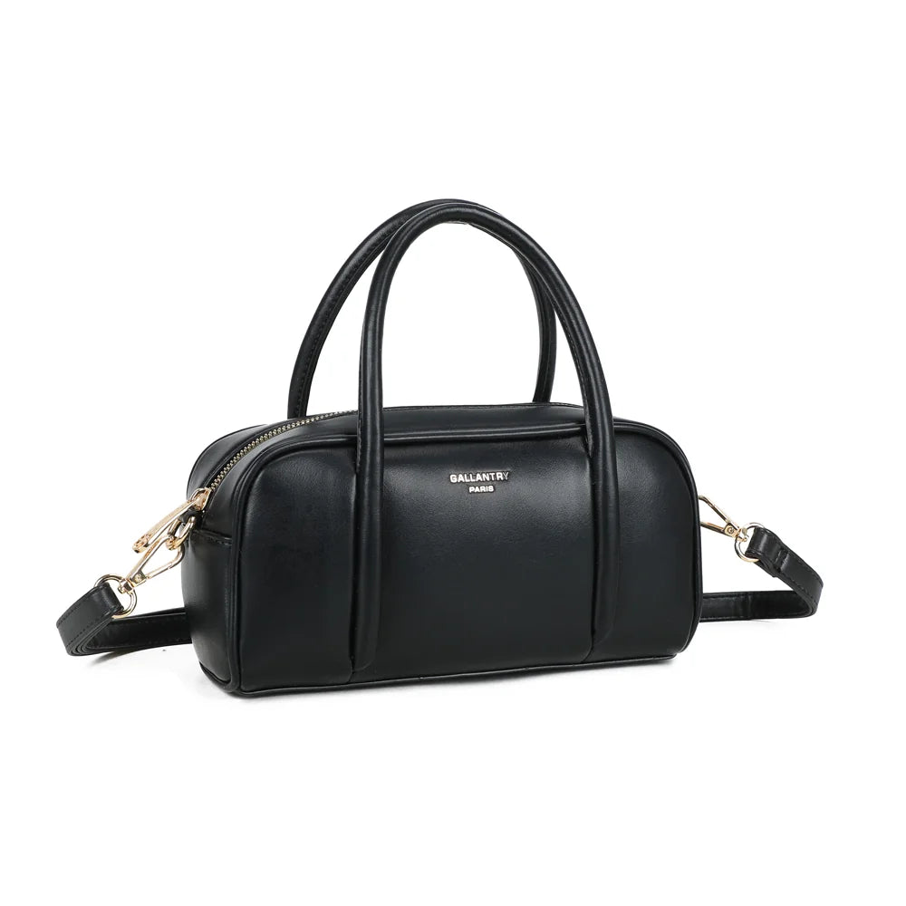 Pauline noir vu de trois quarts : volume arrondi, fermeture zippée et plaque logo dorée sur la face – réf. KJ-62090