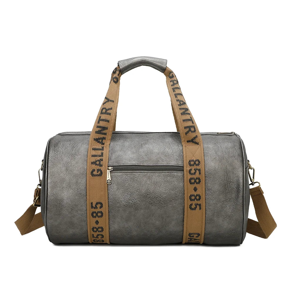 Dos du Polochon gris argenté : sangles siglées qui font le tour du sac et fermeture zippée sur le dessus – réf. Z-83049