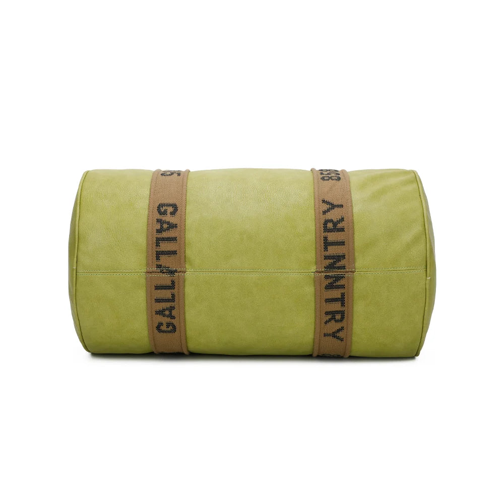 Dessous du Polochon vert pomme : les sangles textiles siglées passent sous le sac cylindrique – réf. Z-83049