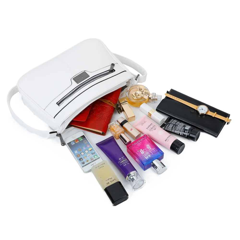 Intérieur du Sora Urban blanc : plusieurs compartiments zippés pour téléphone, clés et maquillage – réf. Z-83016