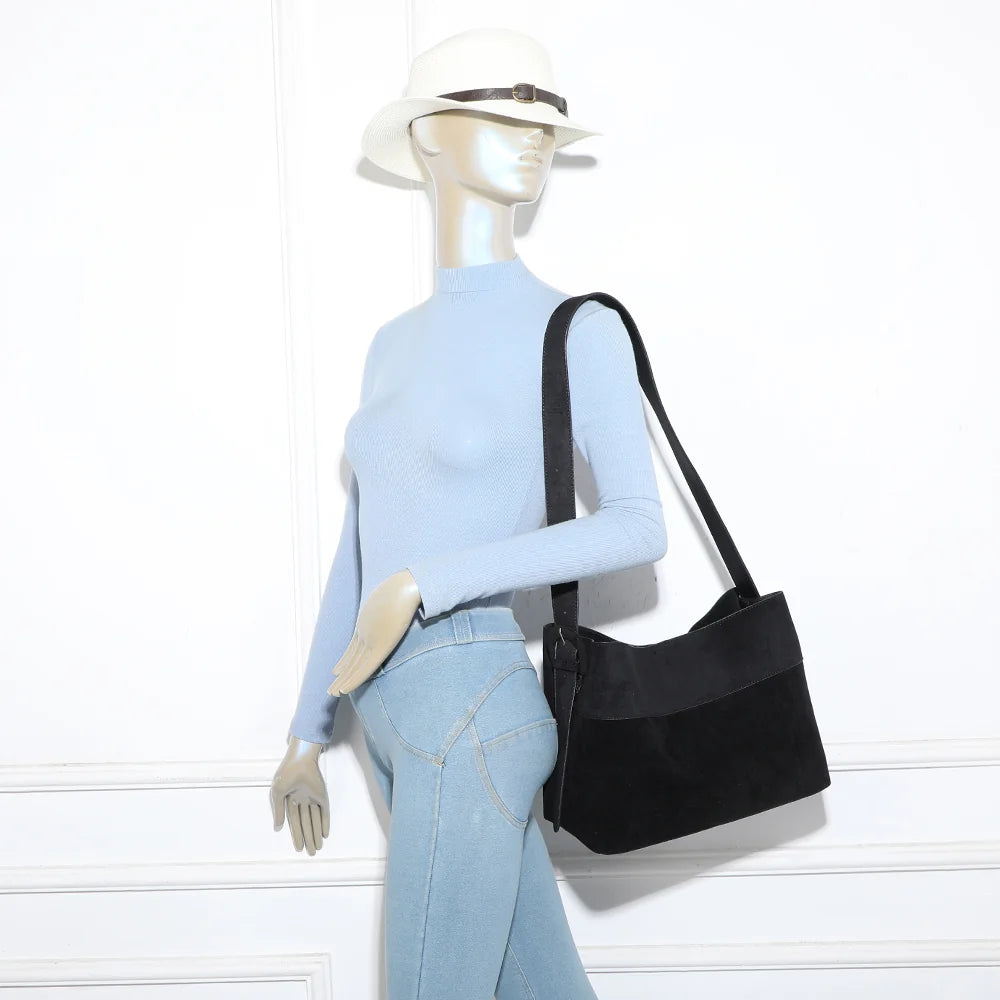 Vanys noir porté à l’épaule : sac hobo femme souple qui épouse la silhouette – réf. R-2018